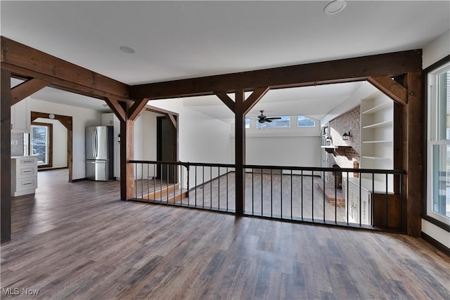 spare room with hardwood / wood-style flooring, plenty of natural light, and ceiling fan