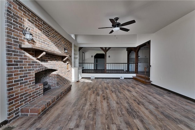 unfurnished living room featuring ceiling fan and hardwood / wood-style flooring