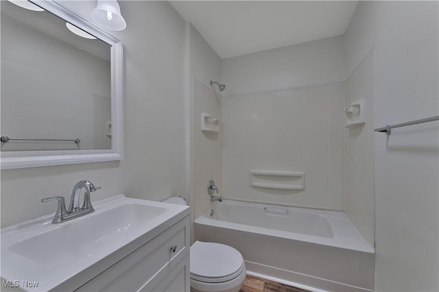 full bathroom featuring vanity, toilet, shower / bathing tub combination, and hardwood / wood-style flooring