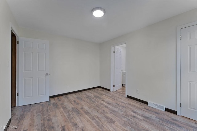 unfurnished bedroom with light hardwood / wood-style floors