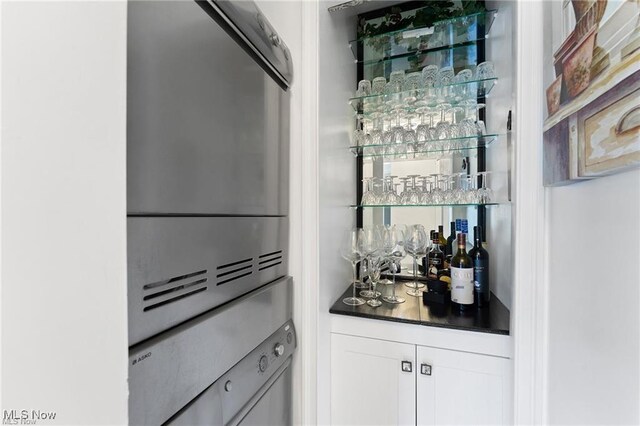 bar featuring white cabinetry