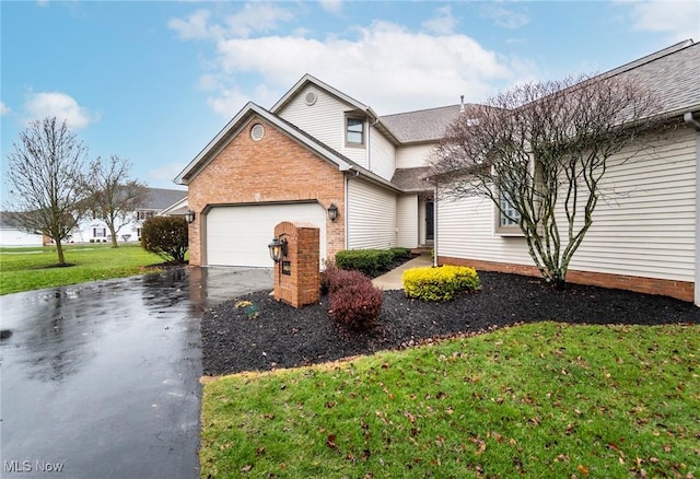 traditional-style home featuring driveway, a garage, a front lawn, and brick siding