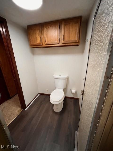 bathroom featuring toilet and hardwood / wood-style floors