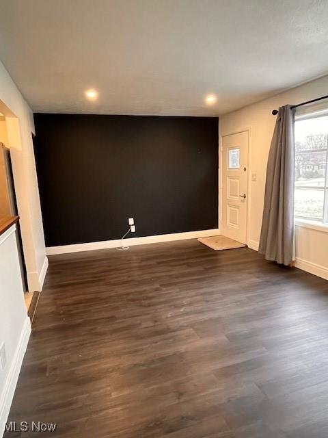 interior space with dark hardwood / wood-style flooring