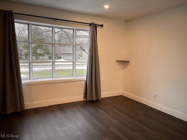 empty room featuring dark hardwood / wood-style floors