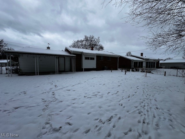 view of snow covered house