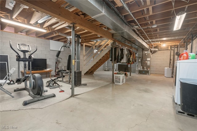 basement with washer / dryer and heating unit