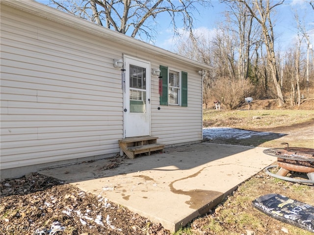 entrance to property with a patio