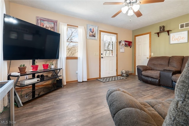 living room with hardwood / wood-style floors and ceiling fan