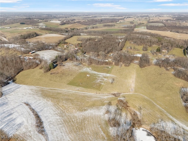 birds eye view of property with a rural view