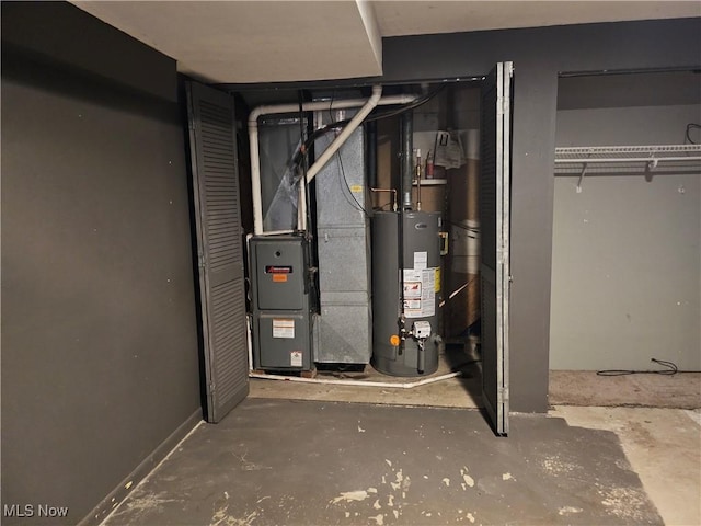 utility room featuring water heater