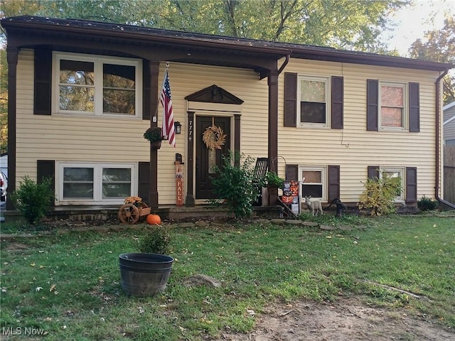 raised ranch featuring a front yard