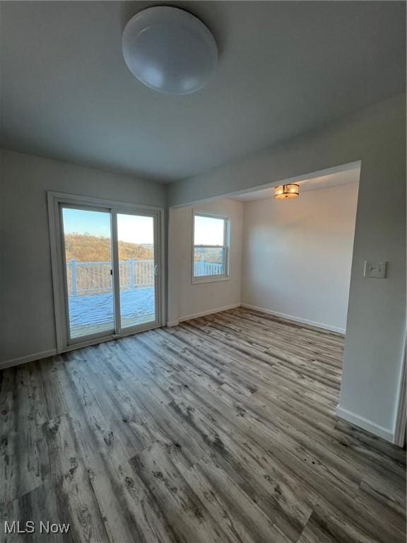 unfurnished room featuring hardwood / wood-style floors