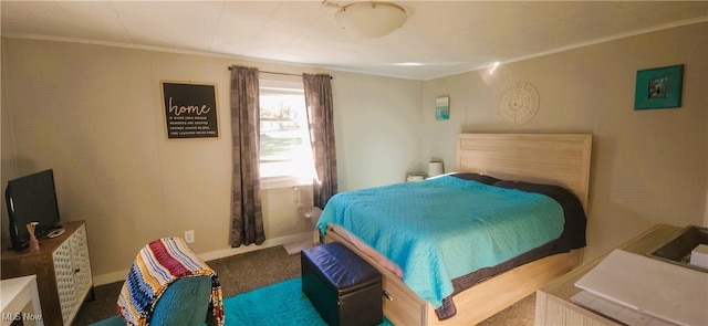 bedroom featuring ornamental molding, carpet flooring, and baseboards