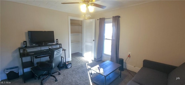 carpeted office space featuring ceiling fan and ornamental molding