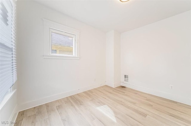 unfurnished room with light hardwood / wood-style floors