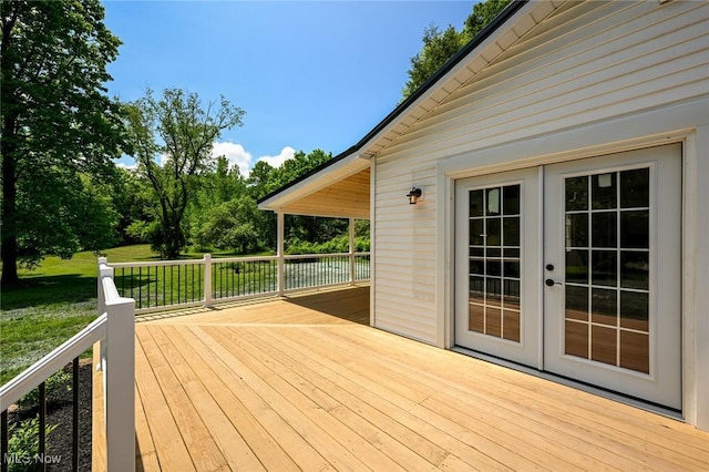 wooden deck featuring french doors