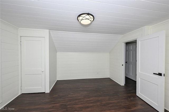 bonus room featuring dark hardwood / wood-style floors and lofted ceiling