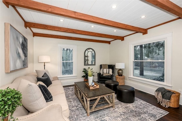 living room featuring beam ceiling and hardwood / wood-style floors