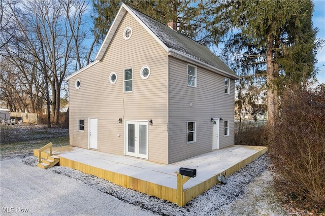 rear view of property featuring a patio area and french doors