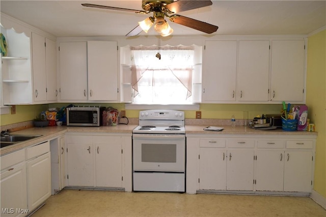 kitchen featuring white electric range oven, ceiling fan, white cabinetry, and sink