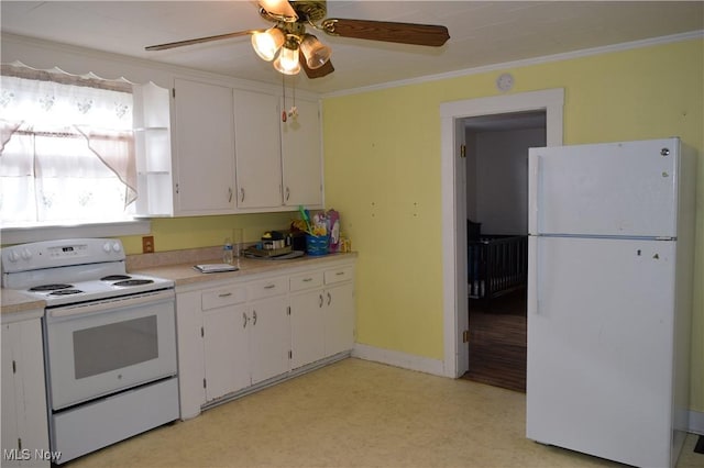 kitchen with crown molding, white cabinets, light carpet, and white appliances