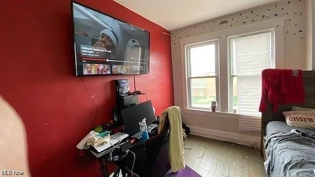 home office with wood-type flooring