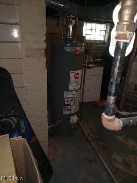 utility room featuring water heater