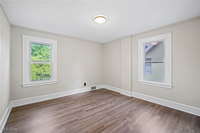 spare room featuring hardwood / wood-style floors