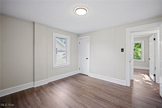 interior space featuring dark hardwood / wood-style flooring and a textured ceiling