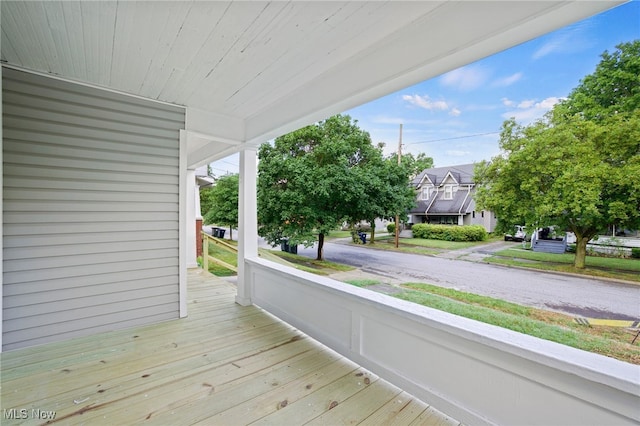 wooden terrace with a porch