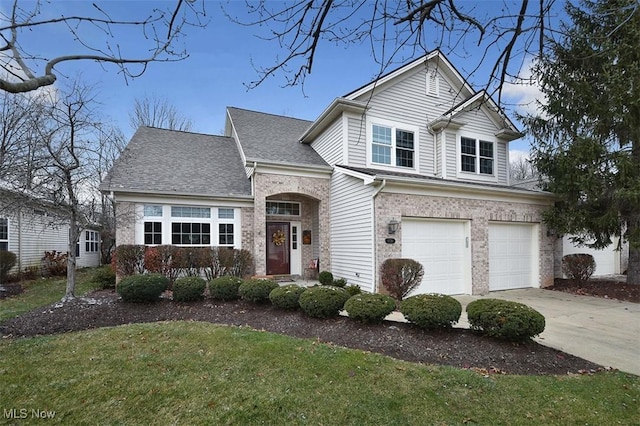 view of front of house featuring a front yard and a garage