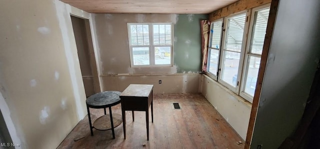 miscellaneous room with light hardwood / wood-style floors and wood ceiling