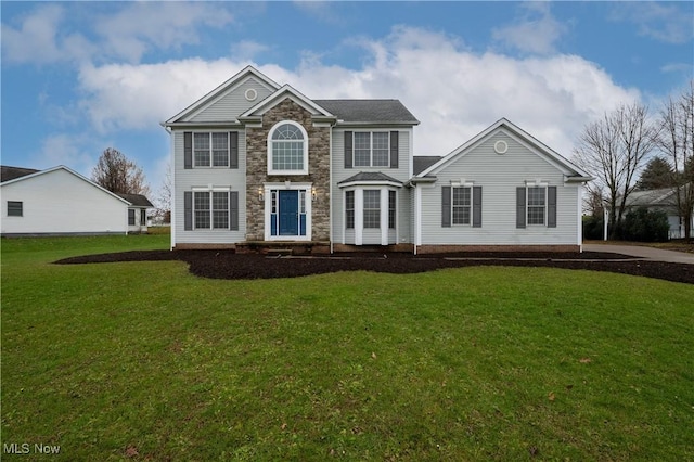 colonial-style house with a front lawn