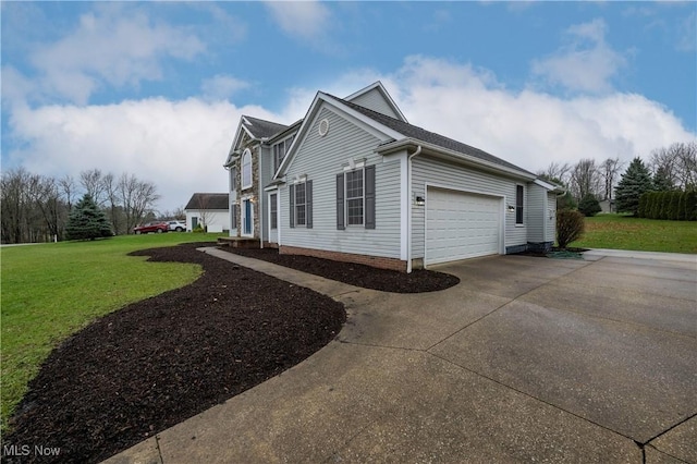 view of side of property featuring a lawn and a garage