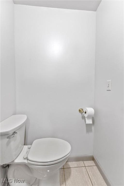 bathroom featuring tile patterned floors and toilet