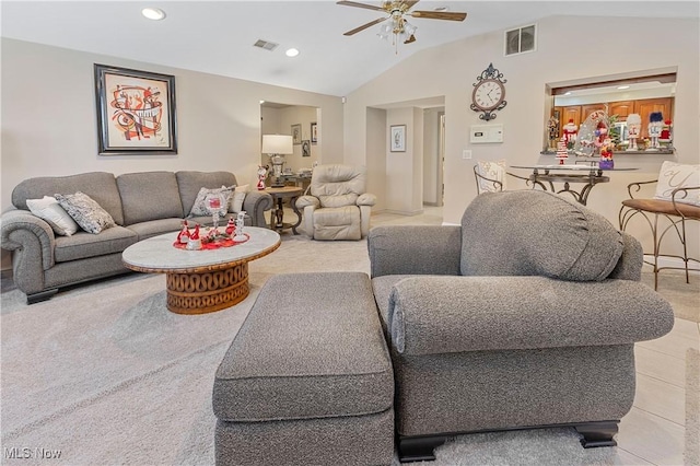 living room featuring ceiling fan, light colored carpet, and vaulted ceiling