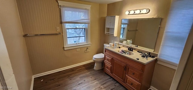 bathroom featuring hardwood / wood-style flooring, vanity, and toilet