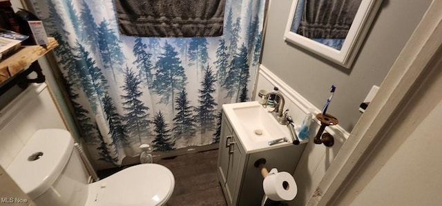 bathroom featuring vanity and toilet