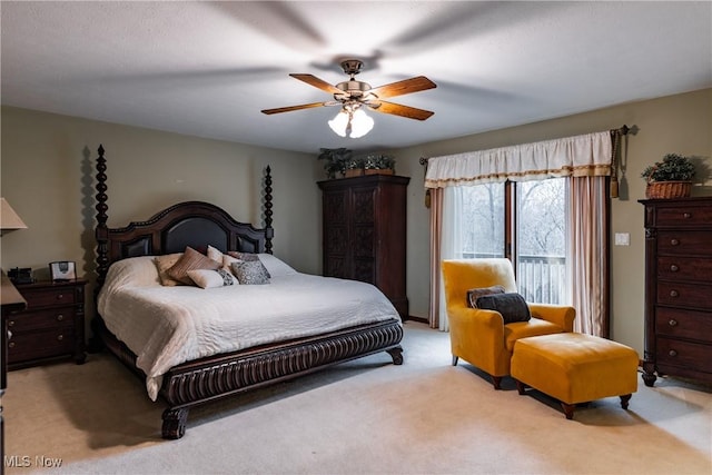 carpeted bedroom with ceiling fan and access to outside