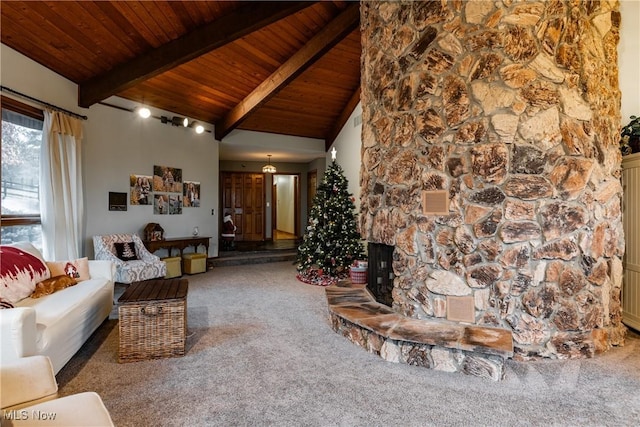 living room featuring carpet flooring, wood ceiling, beam ceiling, high vaulted ceiling, and a stone fireplace