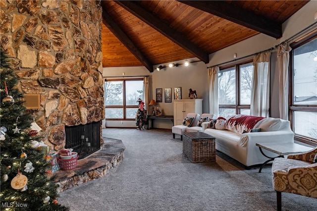 living room with wood ceiling, a healthy amount of sunlight, and dark colored carpet