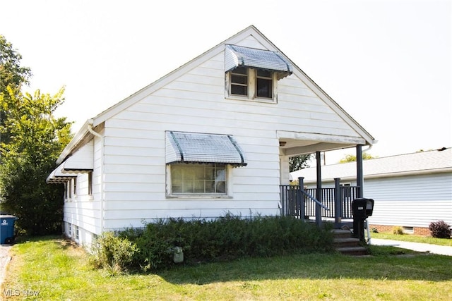 exterior space with a lawn and covered porch