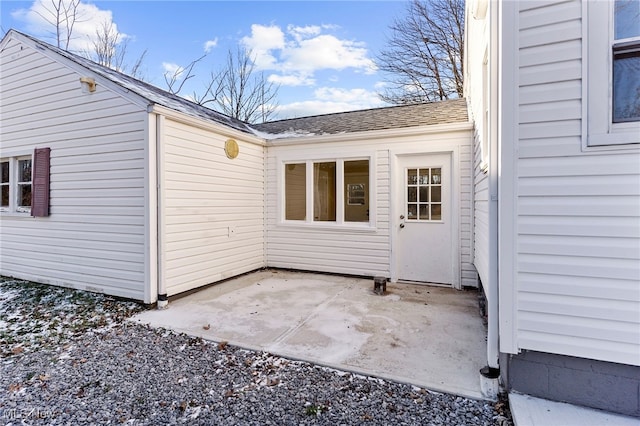 entrance to property with a patio area