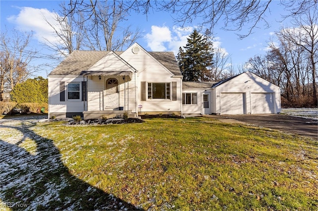 view of front of house with a front yard and a garage