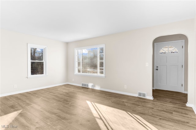 spare room featuring hardwood / wood-style floors