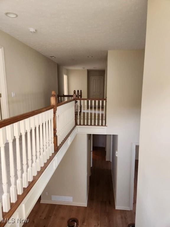 stairway featuring hardwood / wood-style floors