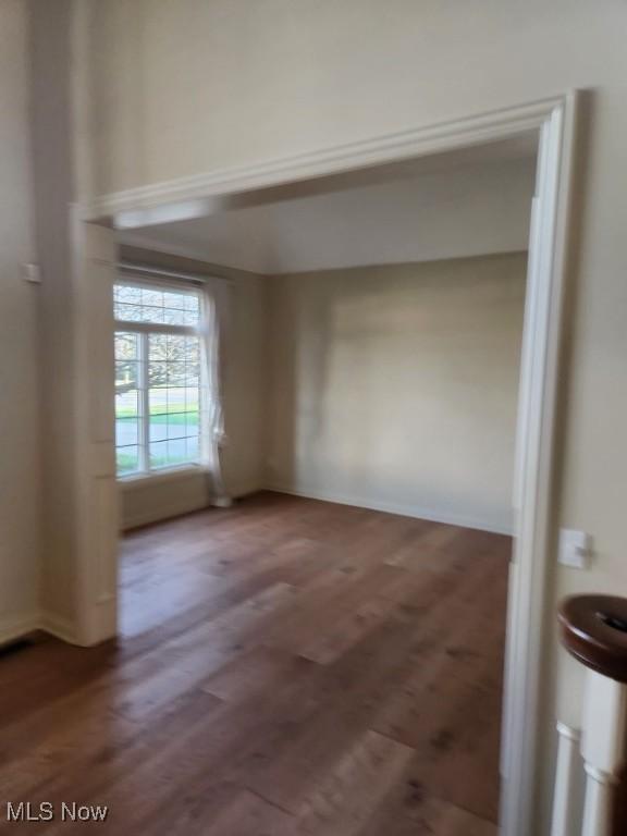 spare room featuring hardwood / wood-style floors