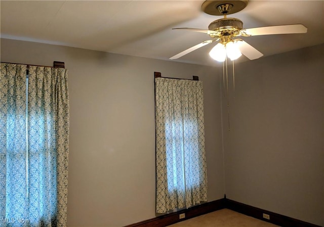 unfurnished room with ceiling fan