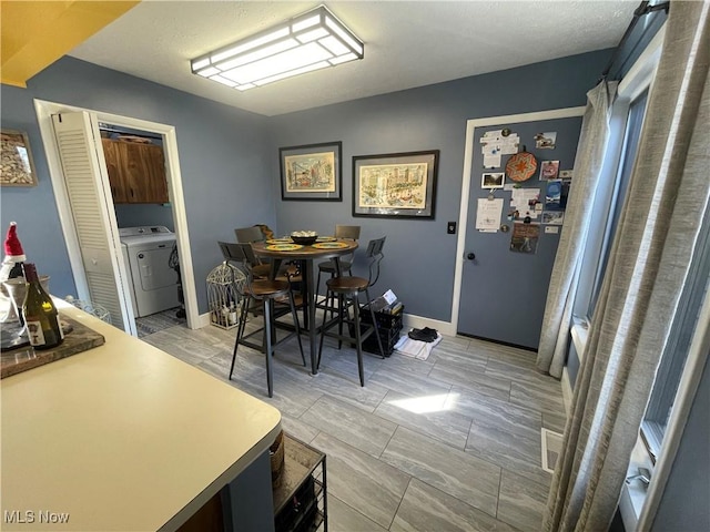 dining space featuring washer / clothes dryer